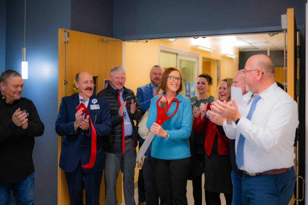 Hospital Commissioner and Greater Grays Harbor Ambassador Lynn Csernotta cuts the ribbon, signifying the public opening of Harbor Regional Healths new Canon Fortain 1.5T MRI.