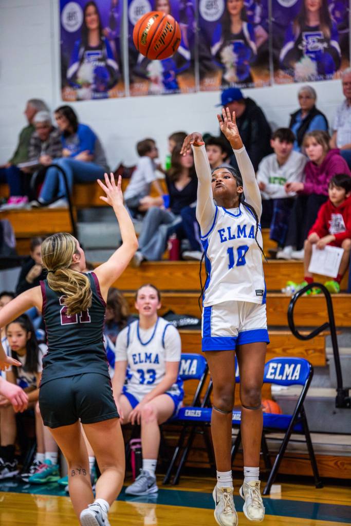 PHOTO BY MIKE ROBERTS Elmas Keke Bol (right) shoots against Montesanos Makena Blancas during the Eagles 40-21 loss on Thursday in Elma.