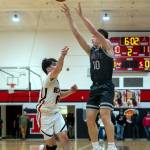 PHOTO BY FOREST WORGUM Montesanos Terek Gunter (10) shoots a 3-pointer during the Bulldogs 43-28 loss to Tenino on Monday at Tenino High School.