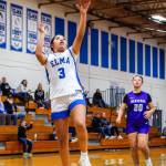 PHOTO BY MIKE ROBERTS Elmas Nency Guzman (3) scored eight points in the fourth quarter to lead the Eagles to a 52-49 victory over Heritage on Monday at Elma High School.