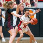 PHOTO BY FOREST WORGUM Montesano guards Tieander Olson (left) and Josie Forster swarm Tenino eighth-grader Kylie Gonia during the Bulldogs 61-15 victory on Monday in Tenino.