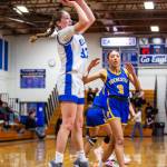 PHOTO BY MIKE ROBERTS Elma Olivia Moore (left) puts up a jump shot against Rochesters Sadies Dupont during the Eagles 44-32 victory on Wednesday in Elma.
