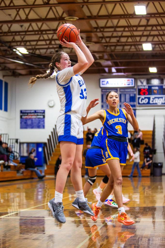 PHOTO BY MIKE ROBERTS Elma Olivia Moore (left) puts up a jump shot against Rochesters Sadies Dupont during the Eagles 44-32 victory on Wednesday in Elma.