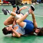 PHOTO BY SUE MICHALAK BUDSBERG Elmas Xavier Espinoza (background) tangles with Gig Harbors Jack Greer during a 120-pound match at the Keigen Langholff Memorial on Saturday at Klahowya Secondary School in Silverdale.
