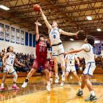 PHOTO BY MIKE ROBERTS Elmas Isaac McGaffey (3) blocks the shot of Hoquiams Lincoln Niemi during the Eagles 66-54 win on Thursday at Elma High School.