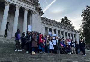 Child care advocates rally on the state Capitol steps on Jan. 22. (Laurel Demkovich / Washington State Standard)