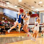 PHOTO BY MIKE ROBERTS Hoquiams Avery Brodhead (right) defends Elmas Olivia Moore during the Grizzlies 44-5 win on Friday at Hoquiam Square Garden.