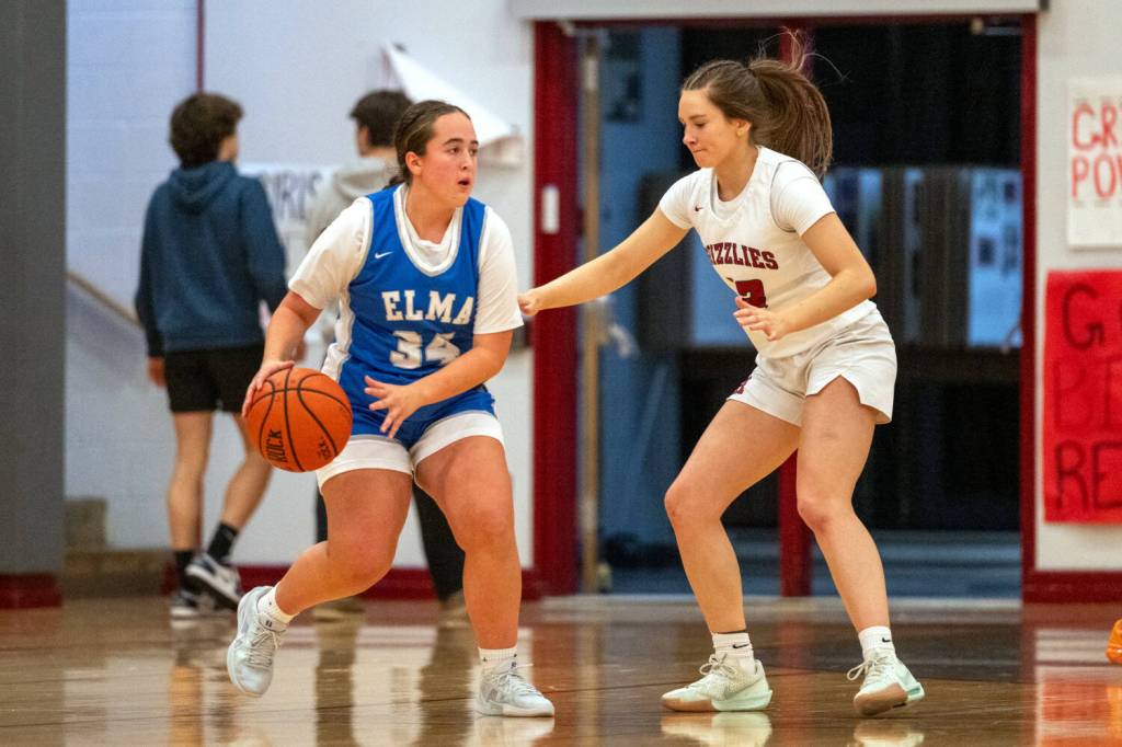 PHOTO BY FOREST WORGUM Elmas Meredith Smith (34) is defended by Hoquiams Katlyn Brodhead during the Grizzlies 44-5 win on Friday in Hoquiam.