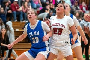 PHOTO BY FOREST WORGUM Elmas Olivia Moore (33) and Hoquiams Aaliyah Kennedy prepare for a rebound during the Grizzlies 44-5 win on Friday in Hoquiam.