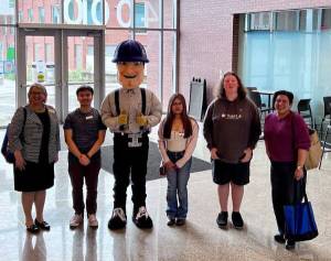 District 6 Rep. Emily Randall (right) standing with students, Charlie Choker and Grays Harbor College President Carli Schiffner (left). (Grays Harbor College)