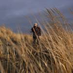 Alan Rammer wanders Copalis Beach in search of treasures. (Dean Rutz / The Seattle Times)