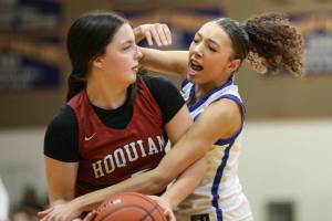 ZACH MARTIN | THE CHRONICLE Hoquiams Lexi LaBounty (left) is guarded by Rochesters Merecedies Dupont during the Grizzlies 60-30 win on Wednesday at Rochester High School.