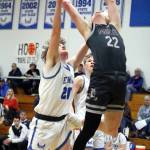 RYAN SPARKS | THE DAILY WORLD Elmas Dakota Myer (20) fouls Montesanos Mason Fry (22) during the Eagles 47-37 win on Wednesday at Elma High School.