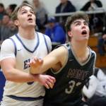 RYAN SPARKS | THE DAILY WORLD Elmas Traden Carter (left) and Montesanos Nathan Dowler ready for a rebound during the Eagles 47-37 win on Wednesday at Elma High School.