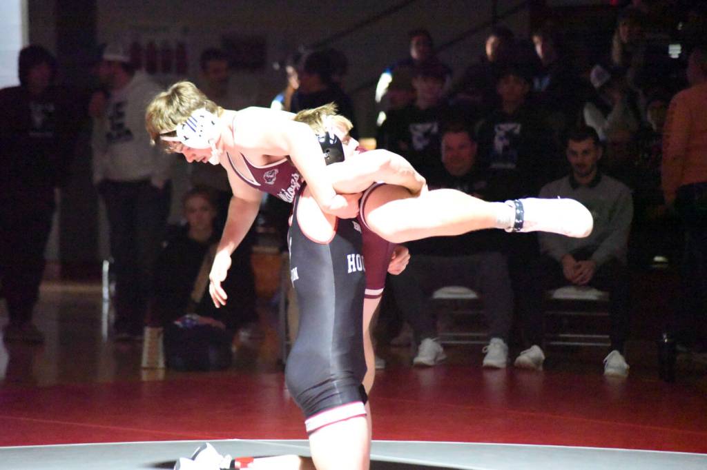 PHOTO BY SUE MICHALAK BUDSBERG Hoquiams Oliver Bryson (bottom) defeated Montesanos Kyle Caton during the 190-pound title match at the 1A District 4 EvCo tournament on Saturday at Hoquiam High School.