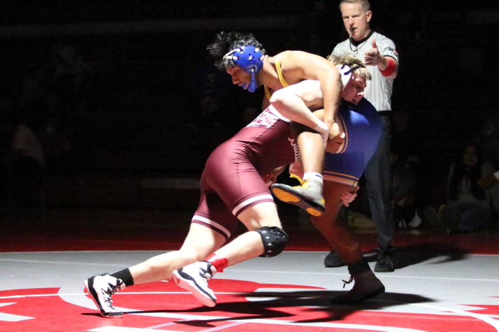 RYAN SPARKS | THE DAILY WORLD Montesanos Gabe Pyhala (left) attempts to take down Rochesters Christopher Tartios during the 1A District 4 EvCo tournament on Saturday at Hoquiam High School.