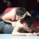 PHOTO BY SUE MICHALAK BUDSBERG Montesanos Felix Romero (top) defeated Elmas Alex Dryden to win the 215-pound championship at the 1A District 4 EvCo tournament on Saturday at Hoquiam High School.