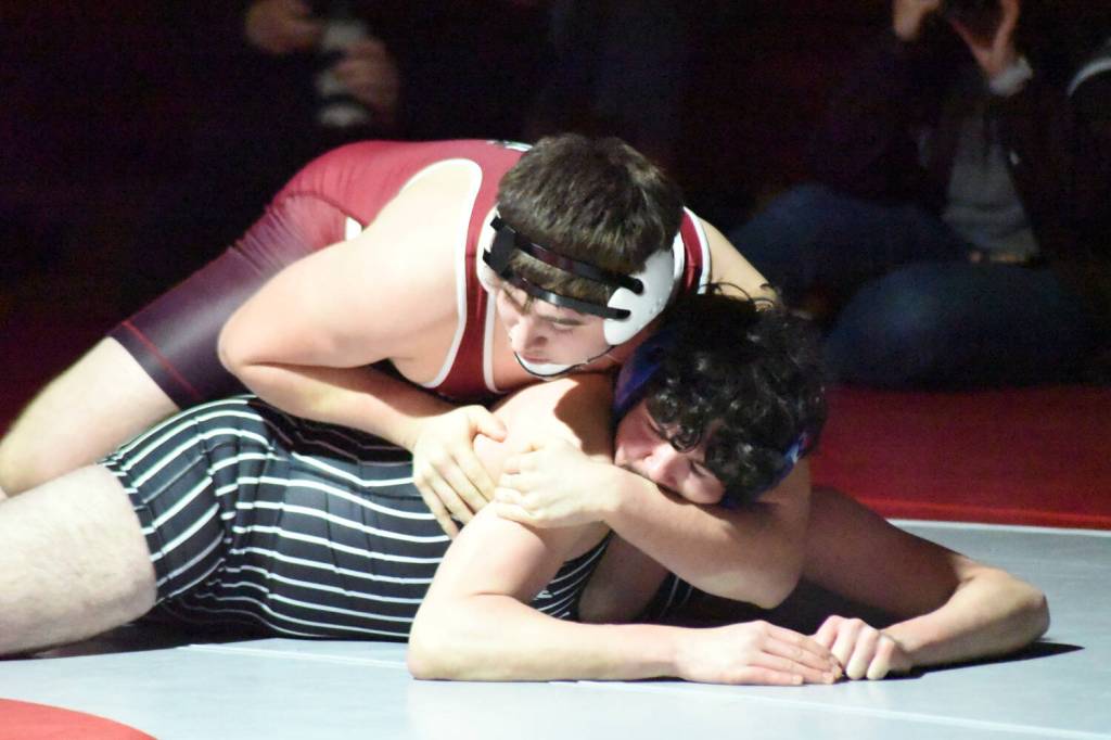 PHOTO BY SUE MICHALAK BUDSBERG Montesanos Felix Romero (top) defeated Elmas Alex Dryden to win the 215-pound championship at the 1A District 4 EvCo tournament on Saturday at Hoquiam High School.