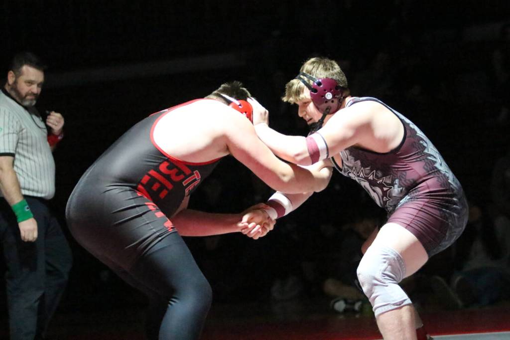 RYAN SPARKS | THE DAILY WORLD Montesanos Lucas Roberts (right) wrestles against Teninos Rowdie Tafoya during the 285-pound championship at the 1A District 4 EvCo tournament on Saturday at Hoquiam High School.