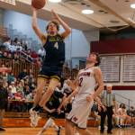 PHOTO BY FOREST WORGUM Aberdeens Tarren Lewis (4) drives to the hoop against Hoquiams Ethan Byron during the Grizzlies 53-44 victory on Saturday at Hoquiam Square Garden.