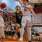 PHOTO BY FOREST WORGUM Aberdeens Isaac Garcia (12) drives the lane against Hoquiams Victor Azevedo during the Grizzlies 53-44 victory on Saturday at Hoquiam Square Garden.