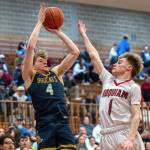 PHOTO BY FOREST WORGUM Aberdeens Tarren Lewis (4) shoots against Hoquiams Ryker Maxfield during the Grizzlies 53-44 victory on Saturday at Hoquiam Square Garden.