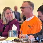 Wade Eric Iseminger sits with his defense attorneys, Ruth Rivas and Luke Laughlin.