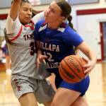 RYAN SPARKS | THE DAILY WORLD Willapa Valleys Lauren Matlock (right) drives against Taholahs Keeliana McCrory during the Chitwhins 53-48 victory on Tuesday at Hoquiam High School.