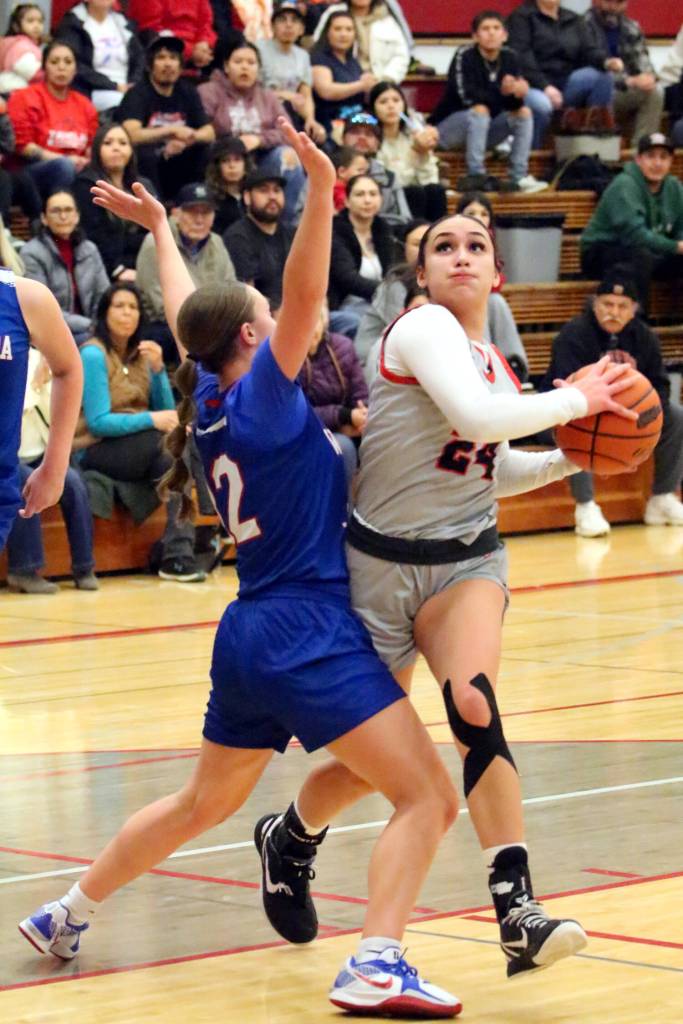 RYAN SPARKS | THE DAILY WORLD Taholahs Shirleymae Stafford (24) is defended by Willapa Valleys Lauren Matlock during the Chitwhins 53-48 victory on Tuesday at Hoquiam High School.