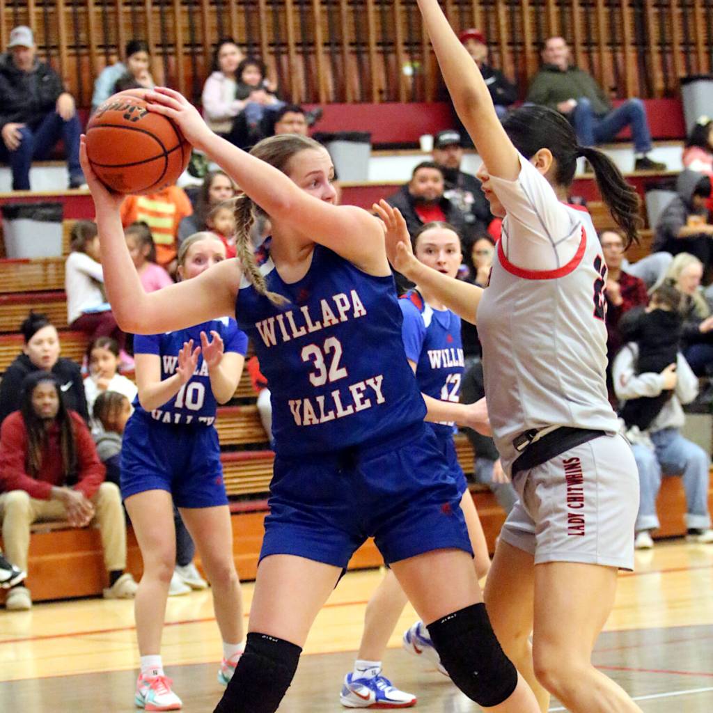 RYAN SPARKS | THE DAILY WORLD Willapa Valleys Tylar Keeton (32) looks to pass against Taholahs Noelani McCrory during the Vikings 53-48 loss on Tuesday at Hoquiam High School. Keeton led all scorers with 18 points.