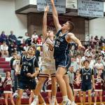 PHOTO BY FOREST WORGUM Montesanos Terek Gunter (10) shoots against Kings Way Christians Reece Johnson during the Bulldogs 65-50 loss in a 1A District 4 Tournament game on Wednesday in Montesano.