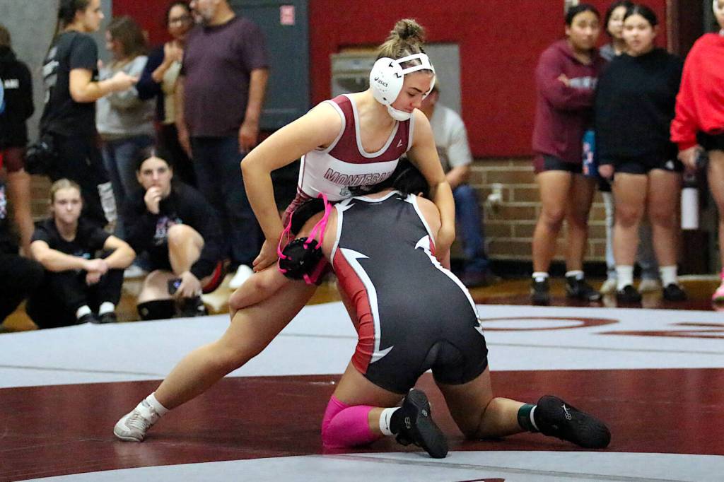 RYAN SPARKS | THE DAILY WORLD Montesanos Emma Peterson (top) defeated Toledos Isabella Garza to win the 155-pound championship at the 1B/2B/1A District 4 Championships on Saturday at Montesano High School.