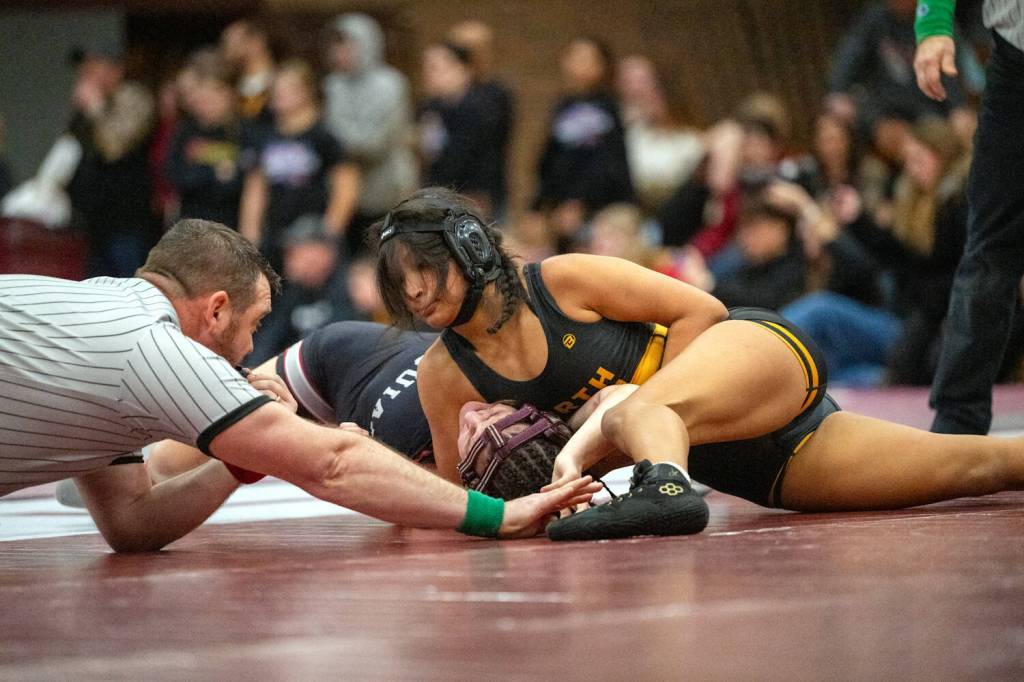 PHOTO BY FOREST WORGUM North Beachs Mayra Strandberg (right) controls Hoquiams Emily Brodhead during the 115-pound title match at the 1B/2B/1A District 4 Championships on Saturday at Montesano High School.