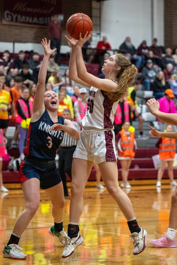 PHOTO BY FOREST WORGUM Montesanos Hazel Jones (20) shoots over Kings Way Christians Bridget Quinn during the Bulldogs 67-50 victory in a 1A District 4 semifinal game on Tuesday at Montesano High School.