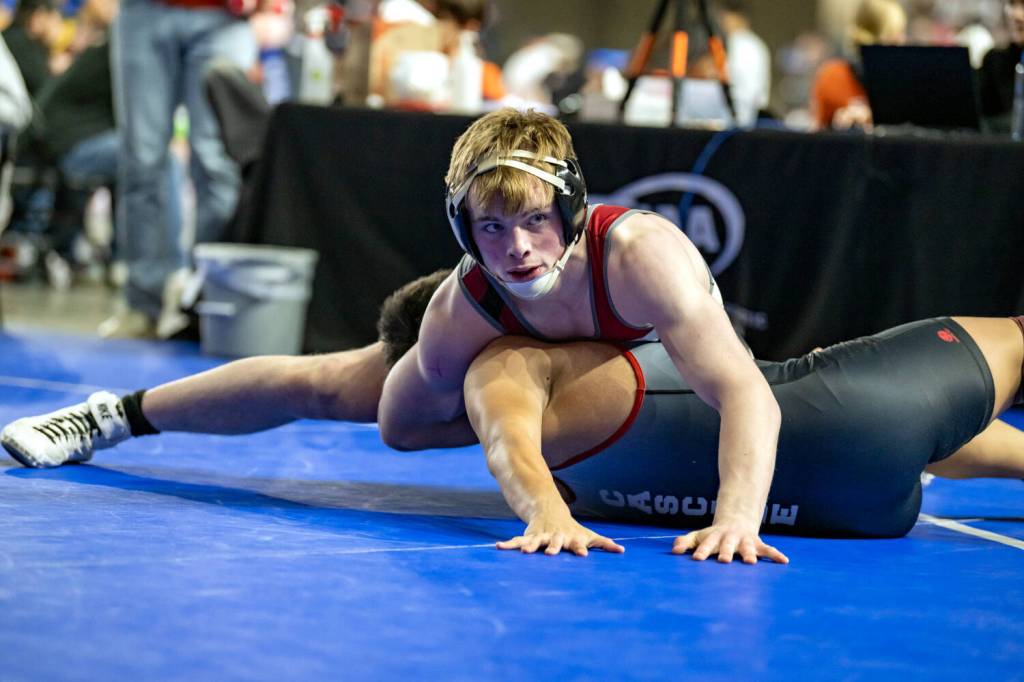 JIM THRALL | MATFOCUS.COM Hoquiams Oliver Bryson (top) earned a pinfall win over Cascades Daniel Guerrero during a 190-pound match during the Mat Classic XXXVI on Friday at the Tacoma Dome.
