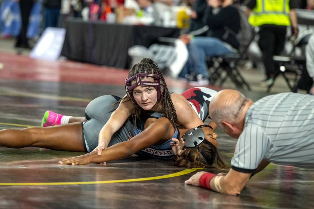 PHOTO BY FOREST WORGUM Hoquiams Emily Brodhead (top) defeated Okanogans Miah McKeever via pinfall during a girls 1A/2B/1B 115-pound match at the Mat Classic XXXVI on Friday at the Tacoma Dome.