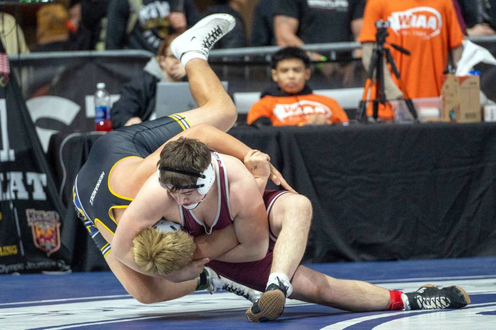 PHOTO BY FOREST WORGUM Montesanos Felix Romero (right) takes down Wapatos Francisco Hernandez during a 215-pound match at the Mat Classic XXXVI on Friday at the Tacoma Dome.