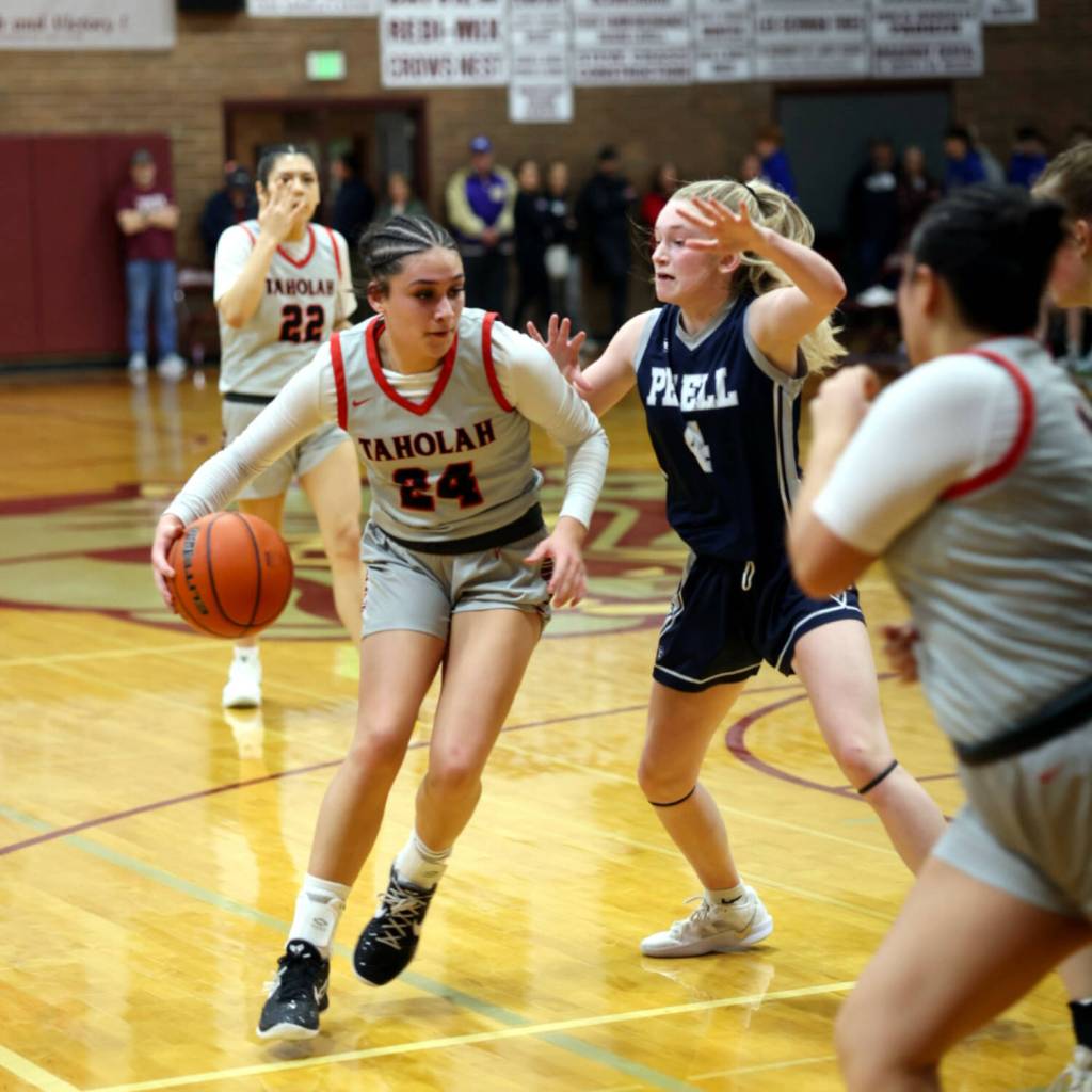 PHOTO BY TIA CHENEY Taholahs Shirleymae Stafford (24) dribbles against Pe Ells Karli Phelps during the 1B District 4 Championship on Saturday in Montesano.