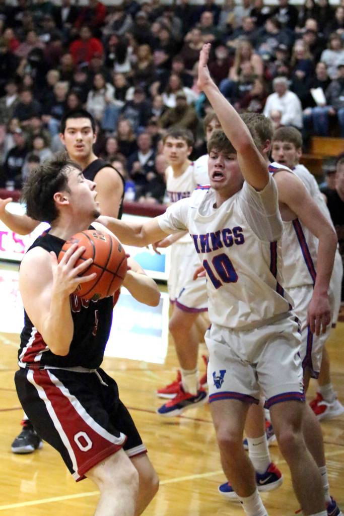 RYAN SPARKS | THE DAILY WORLD Ocostas Noah Prigmore (left) looks to shoot while Willapa Valleys Blane King (10) defends during the Vikings 46-44 win in the 1B District 4 championship game on Saturday at Montesano High School.