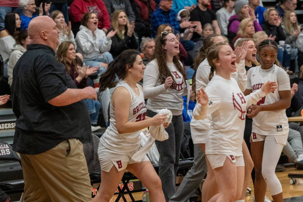 PHOTO BY FOREST WORGUM The Hoquiam Grizzlies celebrate a 43-37 win over Kalama in 1A District 4 elimination game on Saturday in Centralia. Hoquiam advanced to the state tournament with the victory.