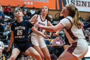 PHOTO BY FOREST WORGUM Montesanos Ava Schrader (middle) battles for a rebound against Seton Catholics Emma Whitehouse during the Bulldogs 46-32 loss in the 1A District 4 title game on Saturday at Centralia High School.