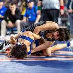 JIM THRALL / MATFOCUS.COM Elma junior Xavier Espinoza (top) contorts Life Christian Academys Elijah Miller during the 1A 113-pound championship match at the Mat Classic XXXVI state meet on Saturday at the Tacoma Dome.