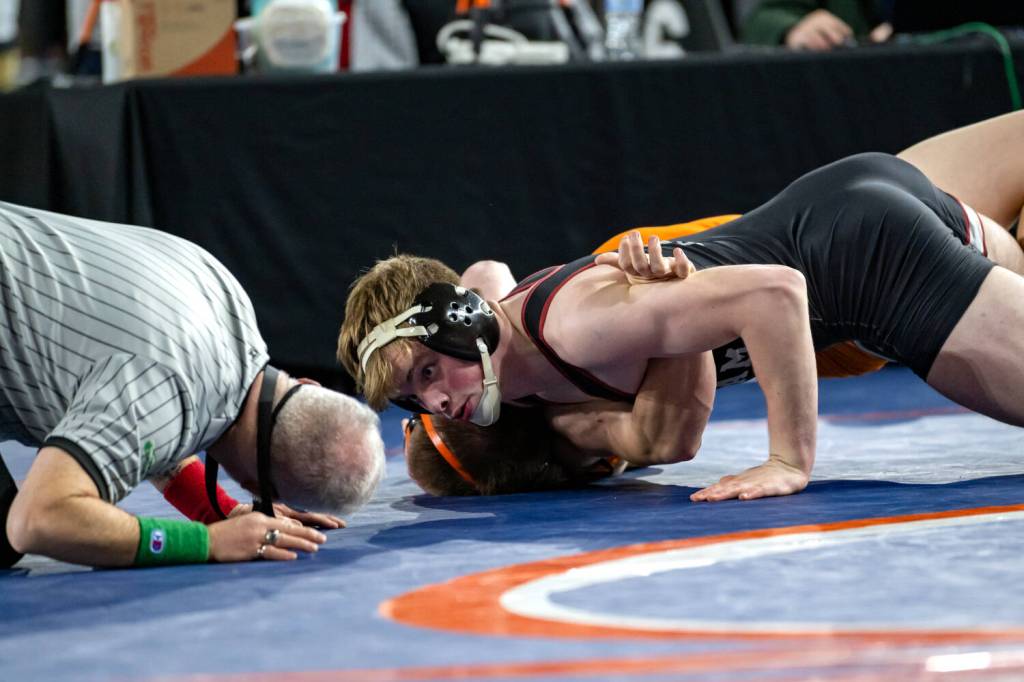 JIM THRALL / MATFOCUS.COM Hoquiams Oliver Bryson (top) works to pin Kalamas Zach Foreman during the 1A class 190-pound championship match at the Mat Classic XXXVI state meet on Saturday at the Tacoma Dome.