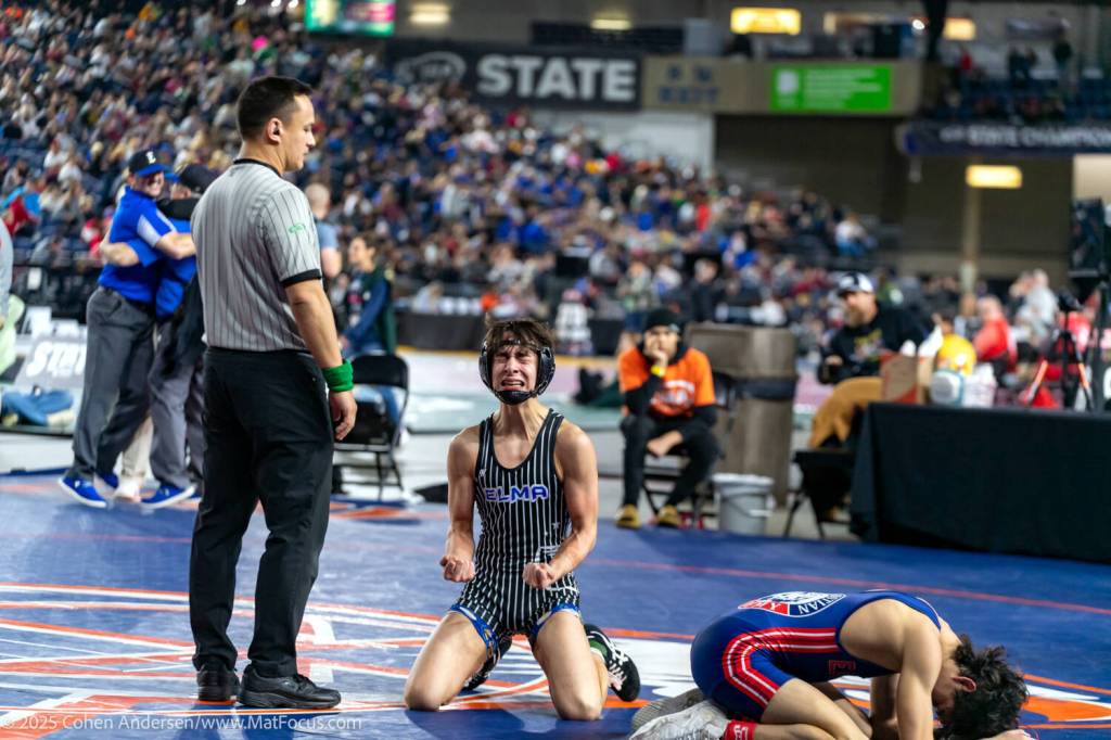 COHEN ANDERSEN | MATFOCUS.COM Elma junior wrestler Xavier Espinoza (kneeling) lets his emotions out after defeating Life Christian Academys Elijah Miller (right) to win the 113-pound state championship on Saturday at the Tacoma Dome.