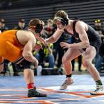 JIM THRALL | MATFOCUS.COM Hoquiam senior Oliver Bryson (right) stares down Kalamas Zach Foreman during the 1A 190-pound state-championship match on Saturday at the Tacoma Dome.