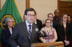 Bill Lucia / Washington State Standard
Gov. Bob Ferguson speaks to reporters at the state Capitol on Feb. 27 about his plans to cut state spending by about $4 billion over four years.