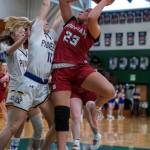 PHOTO BY FOREST WORGUM Hoquiams Aaliyah Kennedy shoots against Nooksack Valleys Kate Shintaffer during the Grizzlies 64-42 loss in a 1A State Tournament game on Saturday at Mount Vernon High School.