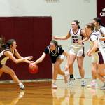 RYAN SPARKS | THE DAILY WORLD Montesanos Makena Blancas (left) competes for a loose ball against The Bush Schools Kate Hutchison during the Bulldogs 47-19 victory in a 1A State Tournament game on Saturday at W.F. West High School.