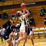 RYAN SPARKS | THE DAILY WORLD Montesano guard Tieander Olson (right) scores and is fouled by The Bush Schools Kara Ma during the Bulldogs 47-19 win in a 1A State Tournament game on Saturday in Chehalis.