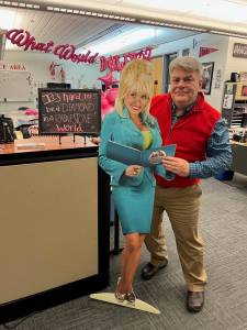 Grays Harbor College
Grays Harbor Colleges TRIO Student Support Services Director JEB Thornton poses for a photo with a cardboard cutout of Dolly Parton. The United Way of Grays Harbor lent the Dolly cutout to TRIO to help promote the annual book drive.